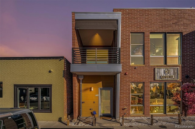 4258 Tennyson St Unit 104, Denver, CO 80212 - rear view of property with a balcony and brick siding