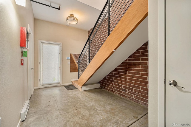 4258 Tennyson St Unit 104, Denver, CO 80212 - foyer with a baseboard radiator and brick wall