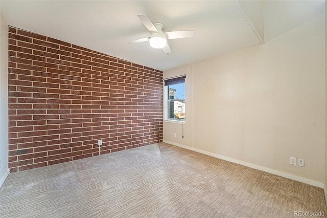 4258 Tennyson St Unit 104, Denver, CO 80212 - empty room with brick wall, carpet floors, and a ceiling fan