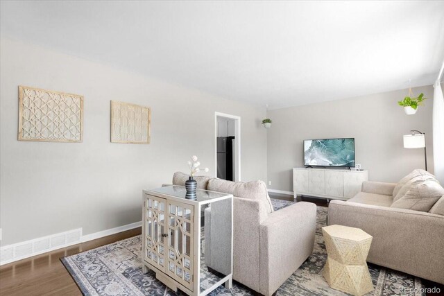 2502 S Lima St, Aurora, CO 80014 - living room with wood finished floors and baseboards