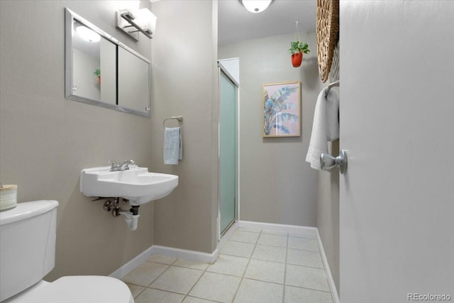 2502 S Lima St, Aurora, CO 80014 - bathroom with a shower stall and tile patterned floors