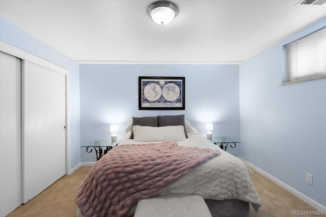 2502 S Lima St, Aurora, CO 80014 - carpeted bedroom featuring a closet and baseboards