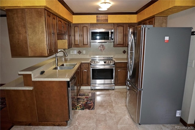 4130 Aspen Ln, Evergreen, CO 80439 - kitchen featuring stainless steel appliances, light countertops, a sink, and crown molding