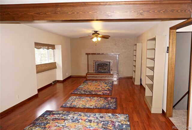 4130 Aspen Ln, Evergreen, CO 80439 - living area with ceiling fan, baseboards, a glass covered fireplace, and wood finished floors