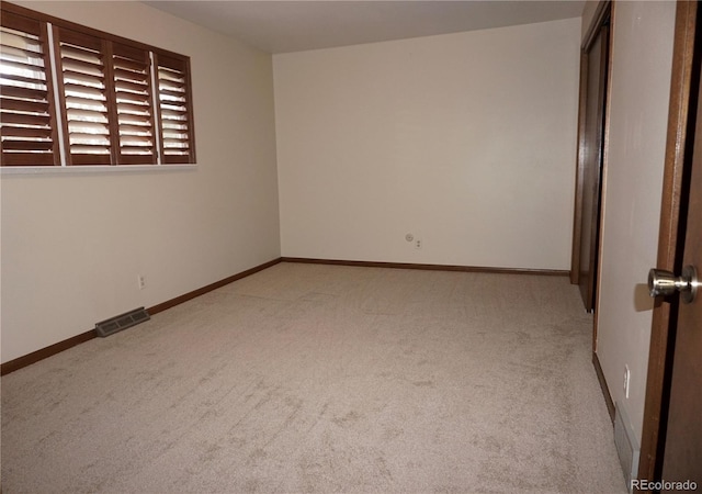 4130 Aspen Ln, Evergreen, CO 80439 - empty room featuring light carpet, baseboards, and visible vents