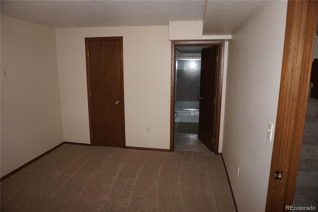 4130 Aspen Ln, Evergreen, CO 80439 - unfurnished bedroom with baseboards and carpet flooring