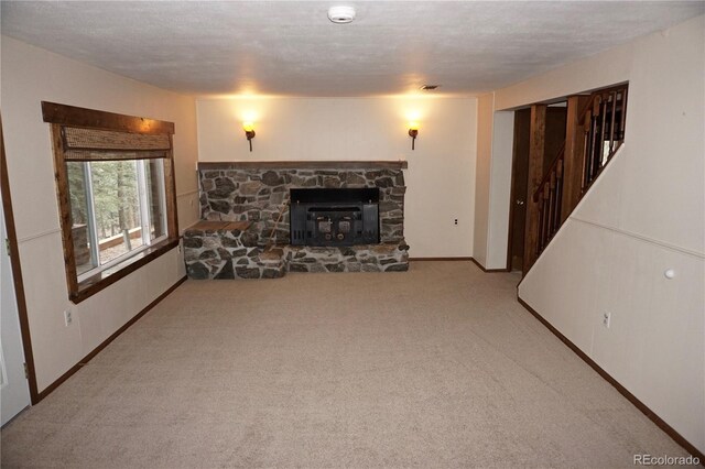 4130 Aspen Ln, Evergreen, CO 80439 - living area featuring baseboards, a textured ceiling, and carpet
