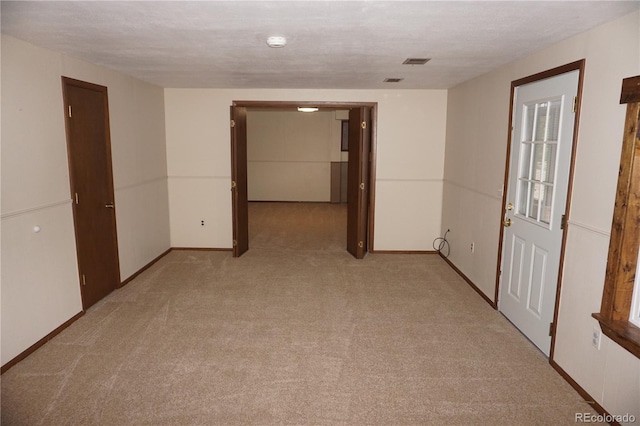 4130 Aspen Ln, Evergreen, CO 80439 - unfurnished room featuring baseboards, visible vents, and light colored carpet