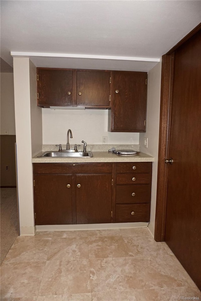 4130 Aspen Ln, Evergreen, CO 80439 - kitchen featuring dark brown cabinetry, light countertops, and a sink