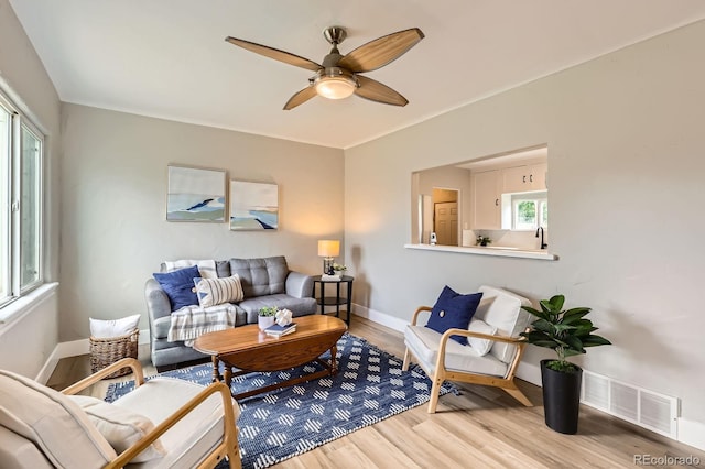 1237 Tamarac St, Denver, CO 80220 - living area with light wood-style floors and ceiling fan
