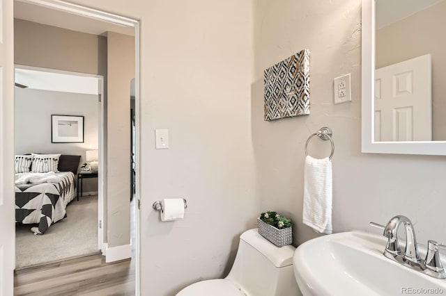 1237 Tamarac St, Denver, CO 80220 - ensuite bathroom featuring a sink and wood finished floors