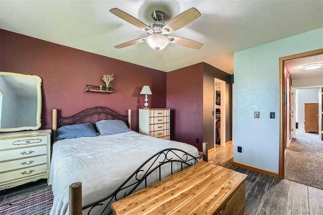 10806 W Evans Ave Unit 5, Lakewood, CO 80227 - bedroom with dark wood-type flooring, baseboards, and a ceiling fan