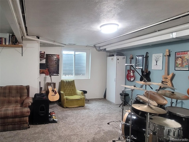 10806 W Evans Ave Unit 5, Lakewood, CO 80227 - rec room featuring a textured ceiling and carpet floors