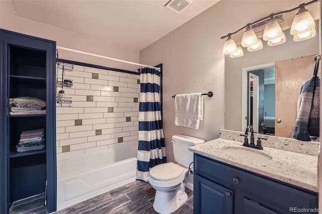 10806 W Evans Ave Unit 5, Lakewood, CO 80227 - bathroom with toilet, vanity, shower / bath combo with shower curtain, and wood finish floors