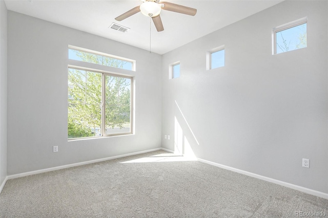 4873 Cathay Ct, Denver, CO 80249 - unfurnished room with carpet, baseboards, a ceiling fan, and visible vents