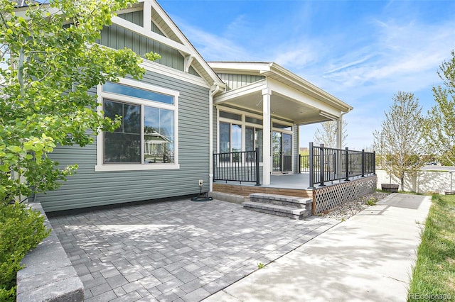 4873 Cathay Ct, Denver, CO 80249 - back of house with board and batten siding and a porch