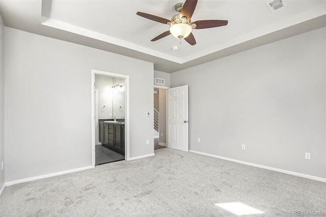 4873 Cathay Ct, Denver, CO 80249 - unfurnished bedroom with carpet, visible vents, baseboards, and a raised ceiling