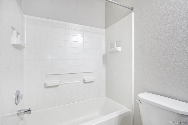 4873 Cathay Ct, Denver, CO 80249 - full bath featuring shower / bathing tub combination, toilet, and a textured wall
