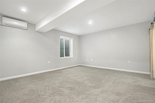 4873 Cathay Ct, Denver, CO 80249 - carpeted empty room featuring a wall mounted air conditioner, a barn door, recessed lighting, and baseboards