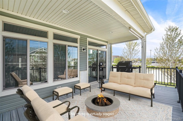 4873 Cathay Ct, Denver, CO 80249 - wooden deck with an outdoor living space with a fire pit and grilling area