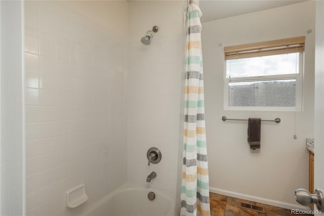 bathroom featuring shower / tub combo, baseboards, visible vents, and vanity