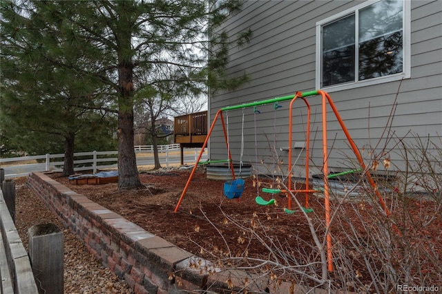 view of jungle gym with fence