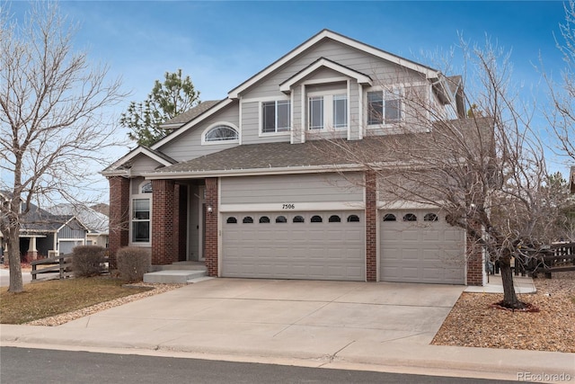 view of front of house featuring driveway, brick siding, an attached garage, and a shingled roof