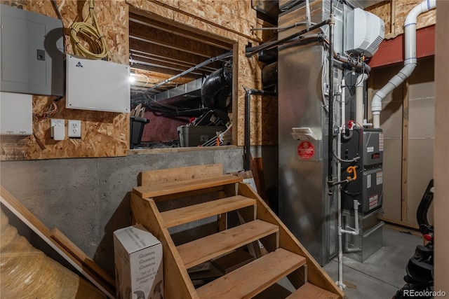 unfinished below grade area with electric panel and heating unit