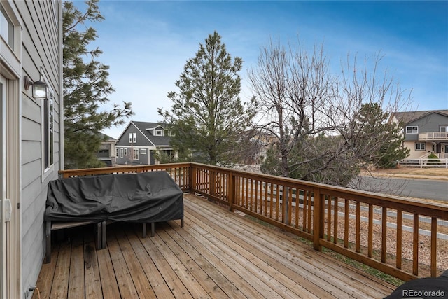 wooden terrace with a residential view