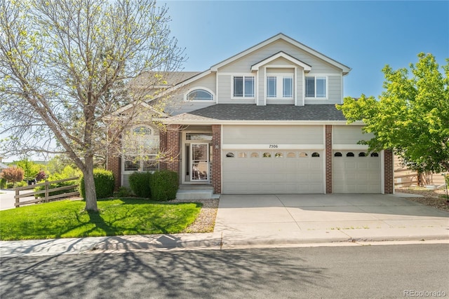 7506 Chipmunk Pl, Littleton, CO 80125 - traditional-style house with brick siding, concrete driveway, an attached garage, fence, and a shingled roof