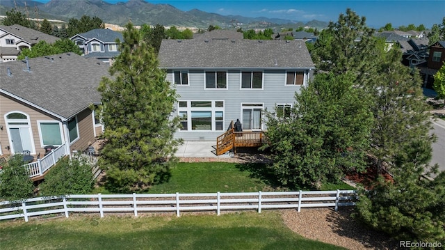 7506 Chipmunk Pl, Littleton, CO 80125 - view of front of house with a residential view and a deck with mountain view