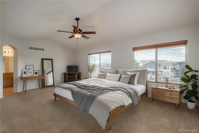 7506 Chipmunk Pl, Littleton, CO 80125 - bedroom featuring lofted ceiling, light carpet, arched walkways, baseboards, and ceiling fan