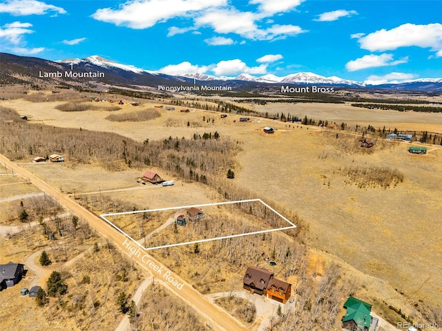 aerial view featuring a rural view and a mountain view