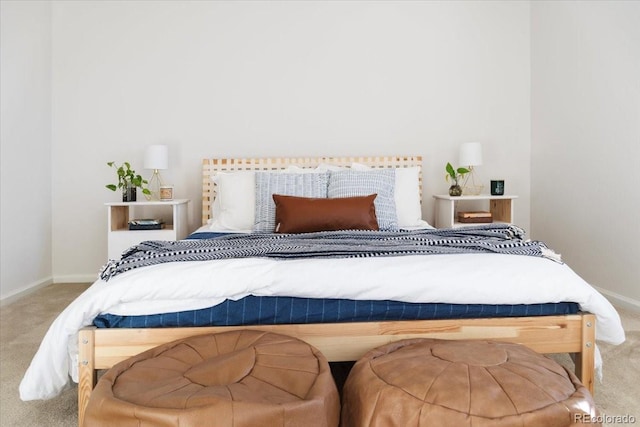 carpeted bedroom featuring baseboards