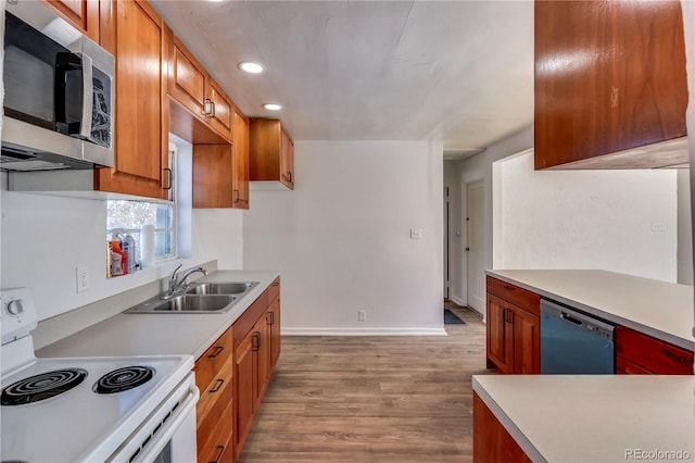 kitchen featuring sink, light hardwood / wood-style floors, and stainless steel appliances