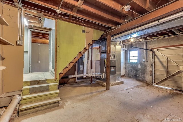 basement with water heater and heating unit