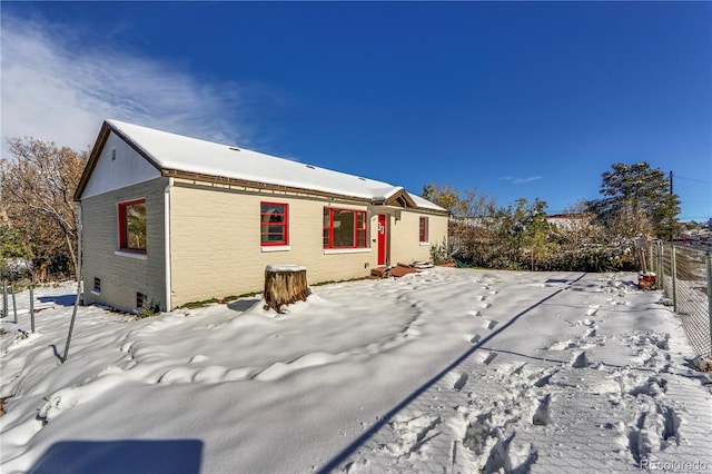 view of snow covered property