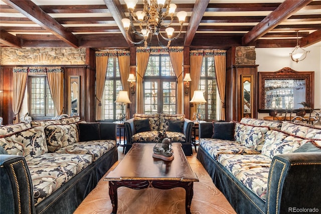 living area with beamed ceiling, a healthy amount of sunlight, and french doors