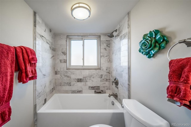 bathroom with shower / bathing tub combination and toilet