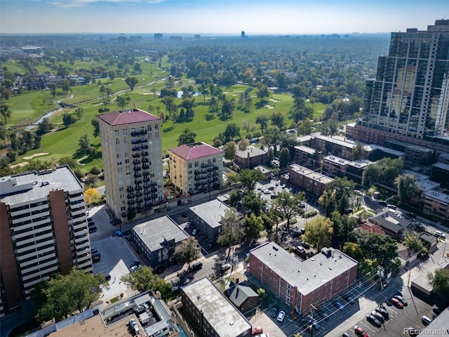 bird's eye view with golf course view and a view of city