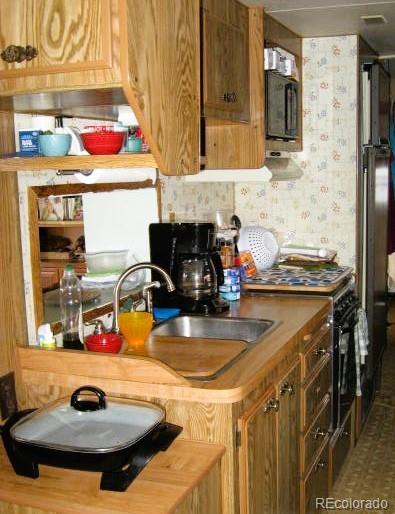 kitchen with sink and stainless steel stove