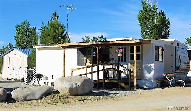 exterior space with a shed