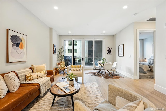 250 Columbine St Unit 310, Denver, CO 80206 - living room with wood finished floors, baseboards, and recessed lighting