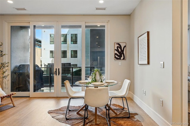 250 Columbine St Unit 310, Denver, CO 80206 - dining space with wood finished floors, french doors, baseboards, and recessed lighting