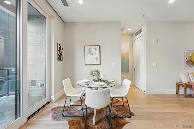 250 Columbine St Unit 310, Denver, CO 80206 - dining area featuring light wood finished floors, baseboards, and recessed lighting