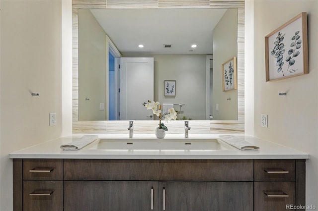 250 Columbine St Unit 310, Denver, CO 80206 - bathroom featuring double vanity and recessed lighting