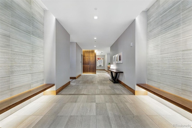 250 Columbine St Unit 310, Denver, CO 80206 - hall with baseboards, recessed lighting, wood finished floors, and an accent wall