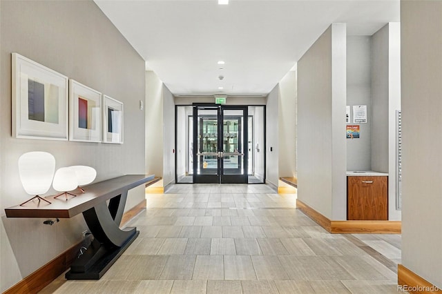 250 Columbine St Unit 310, Denver, CO 80206 - corridor featuring baseboards and french doors