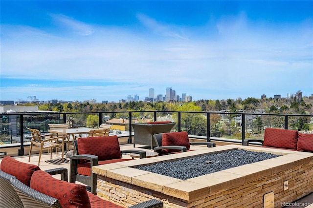 250 Columbine St Unit 310, Denver, CO 80206 - view of patio with a fire pit and a view of skyline