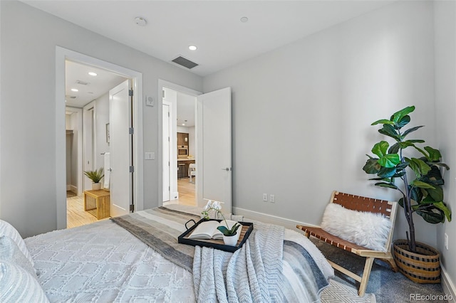 250 Columbine St Unit 310, Denver, CO 80206 - bedroom featuring recessed lighting, wood finished floors, and baseboards